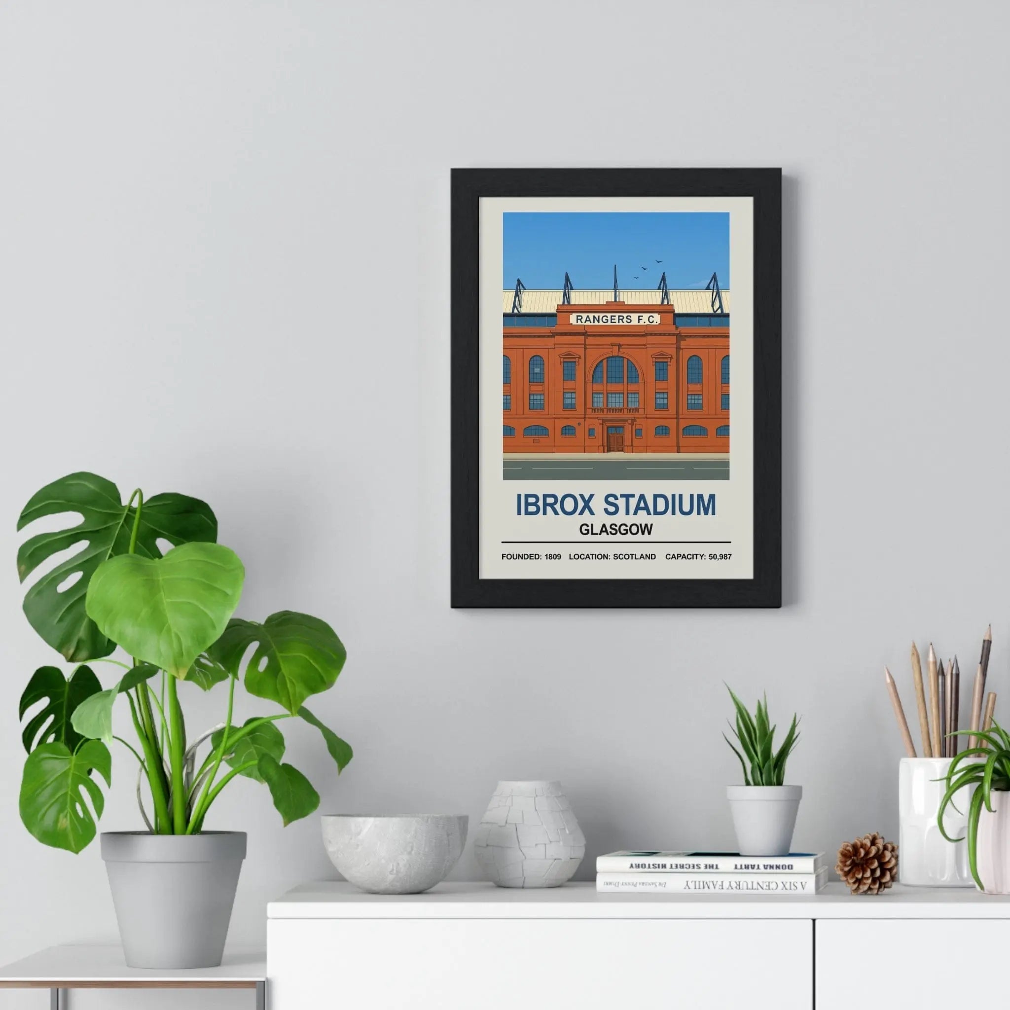 Black-framed stadium print featuring stylized orange ibrox stadium in glasgow with text on its founding year location and capacity