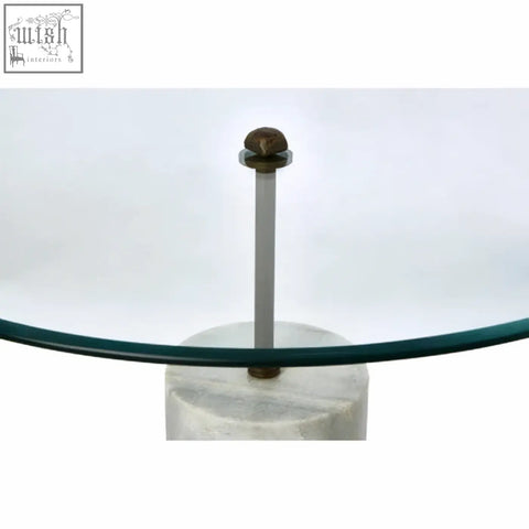 Rany glass and white marble side table with a sleek glass top and elegant white marble base with slender metallic column