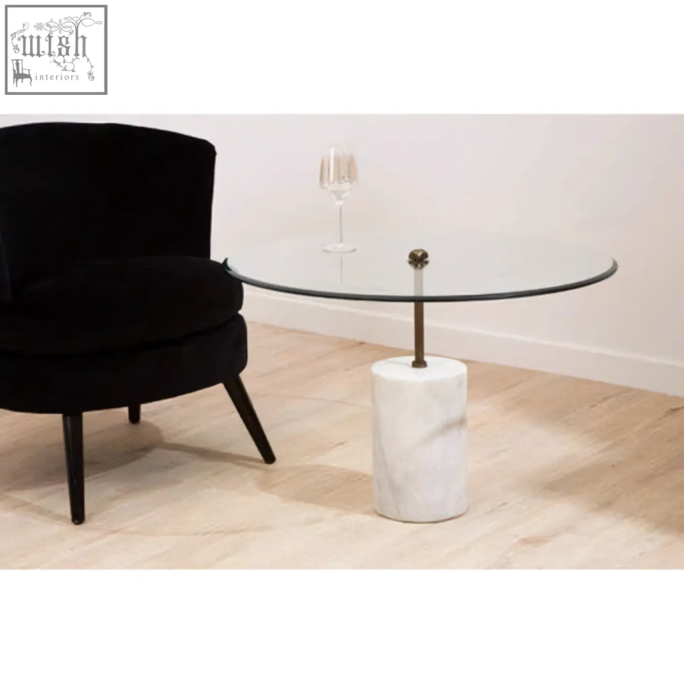 Rany glass and white marble side table with a glass top white marble base and slender antique brass column