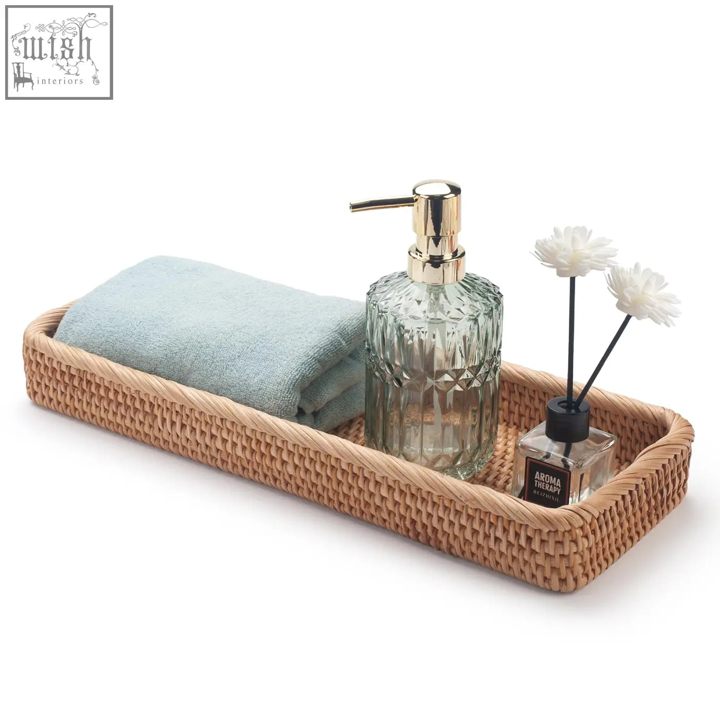 Beige woven rattan bathroom vanity tray with light blue towel and green glass soap dispenser for toilet tank storage