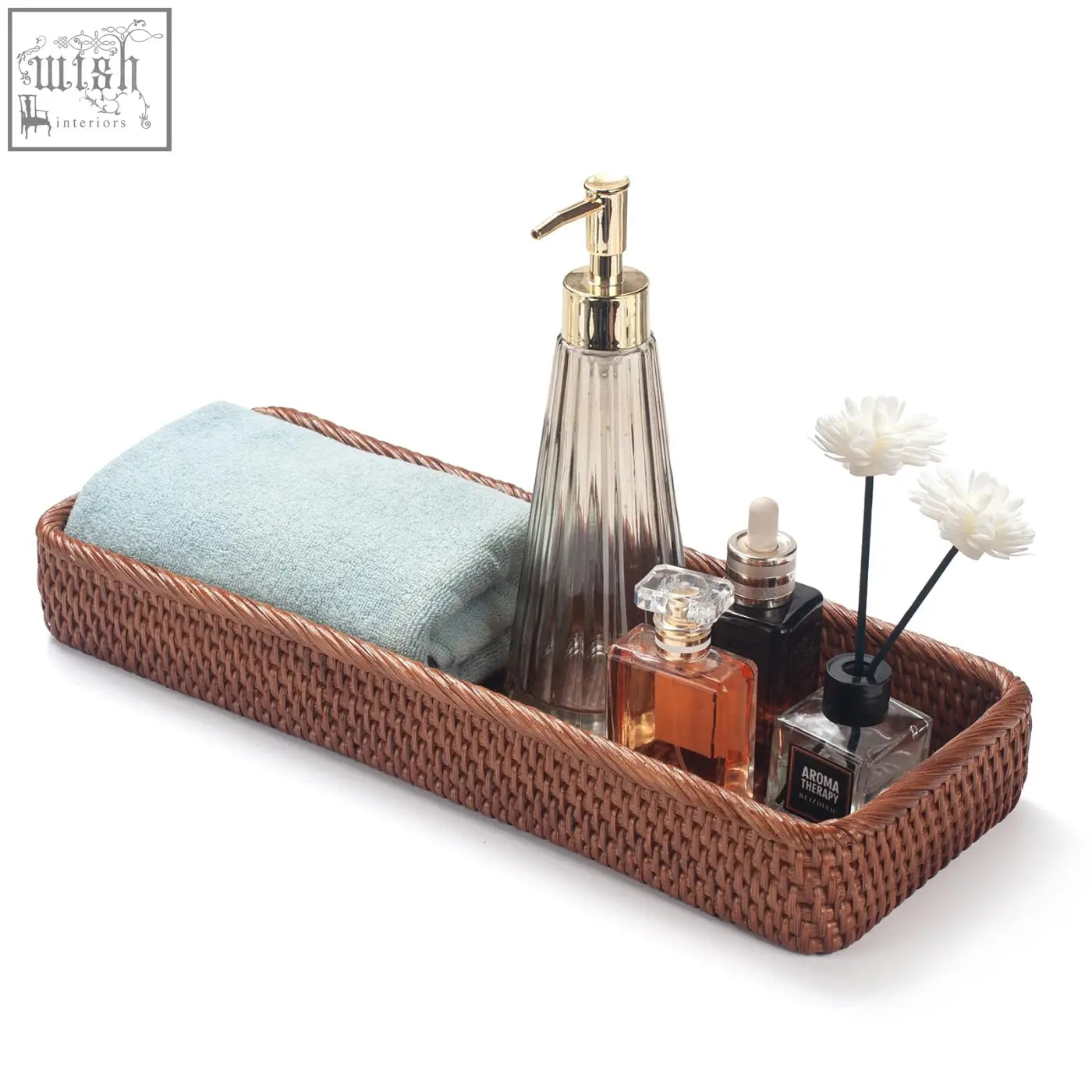 Brown woven rattan bathroom vanity tray with light blue towel and gold pump soap dispenser for toilet tank storage