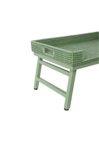 A sage green rattan breakfast tray with woven base and matching painted wooden frame and legs perfect for breakfast tray use