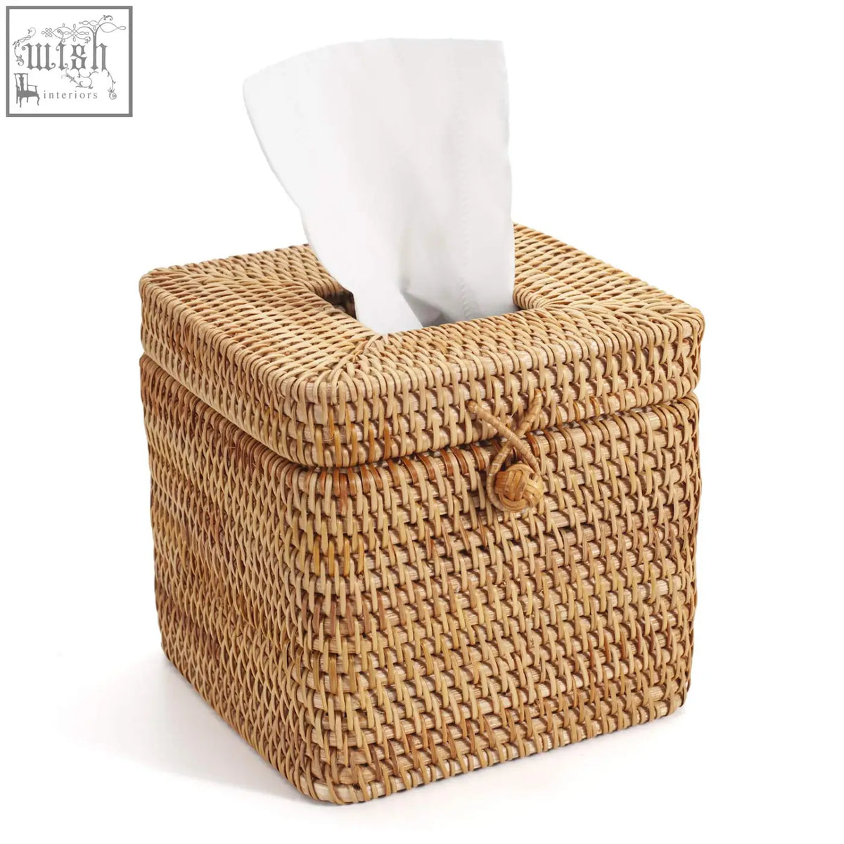 Natural woven rattan square tissue box with tied rope closure and white paper towel partially pulled out