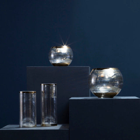 Silver-toned small rounded glass vase with cylindrical and spherical ribbed textured design for decor use