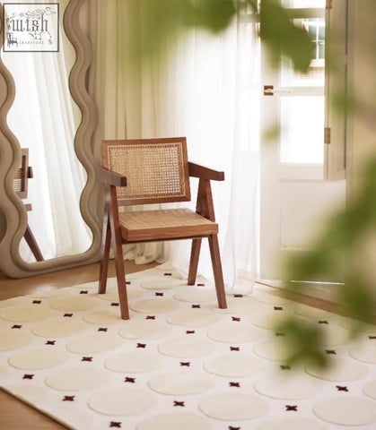 A wooden armchair with dark brown frame and woven cane seat, perfect for pairing with a coffee table set in your living room