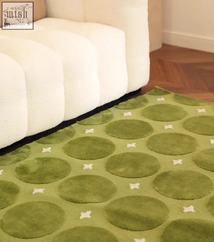 Rebekah living room rug green with circular patterns and white cross accents perfect for coffee table set area
