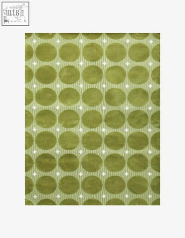 Rebekah living room rug in olive green with circular patterns and white diamonds perfect for coffee table set use