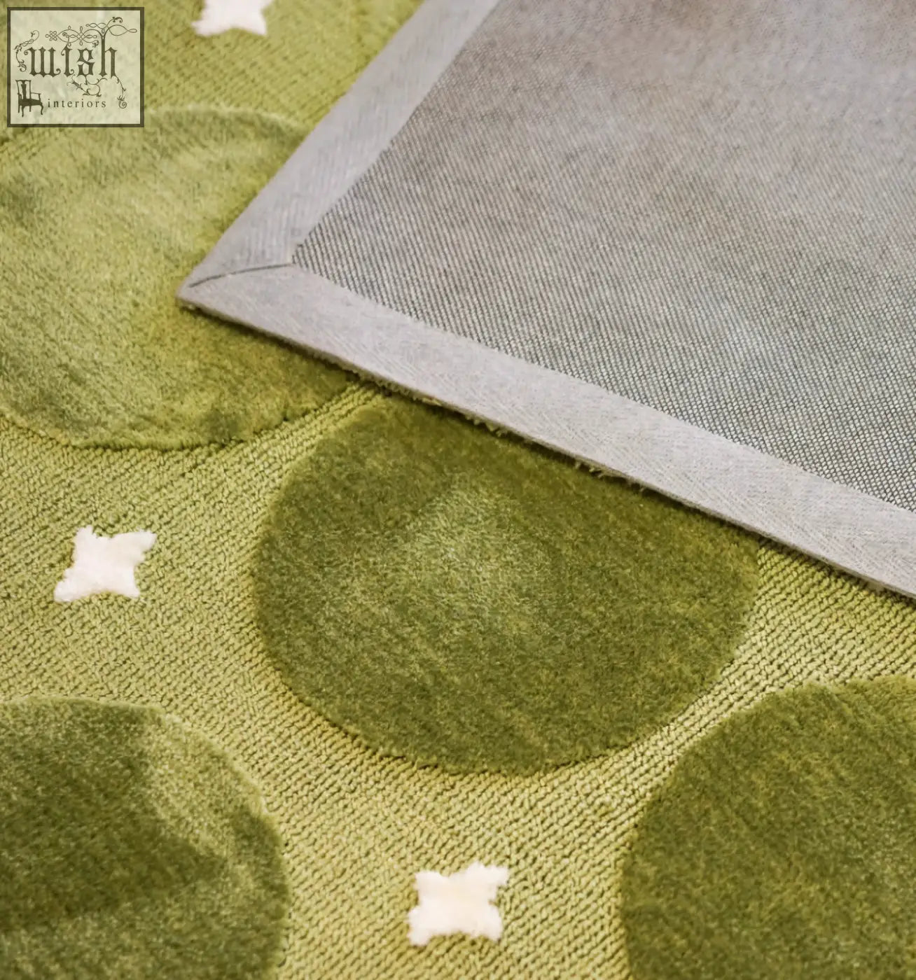 Olive green textured rebekah living room rug with raised circles and white stars perfect for coffee table set areas