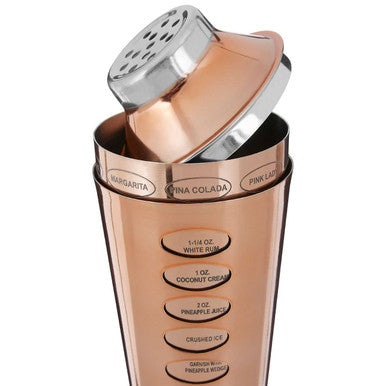 Recipe rose gold cocktail shaker in copper color with silver lid and engraved drink measurements for rose gold cocktails