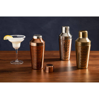 Rose gold cocktail shaker with textured ribbed copper finish and matching lid perfect for gold cocktail mixing