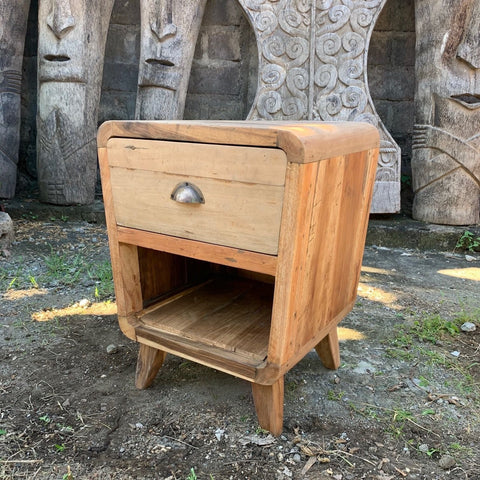 Light brown teak wood nightstand with single drawer and tapered legs made from upcycled retired fishing boats wood