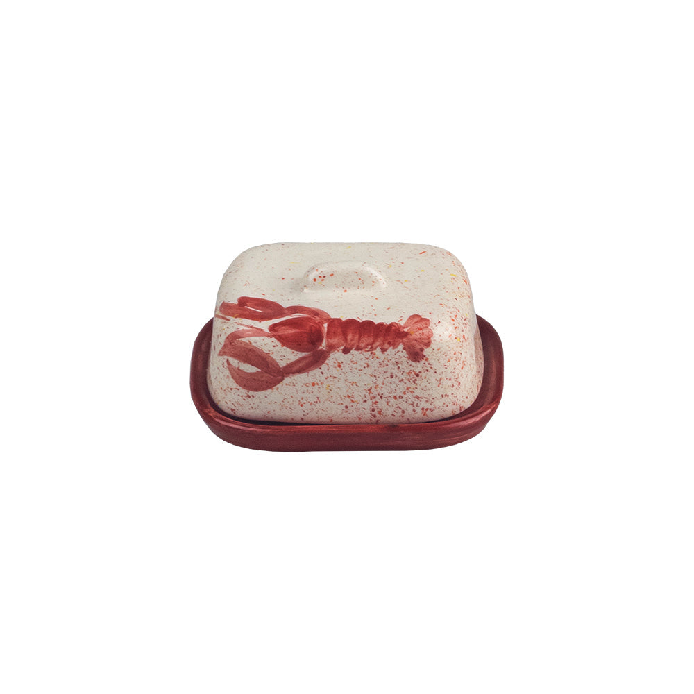 Cream-colored speckled mini ceramic butter dish with red lobster design and matching red ceramic butter dish base