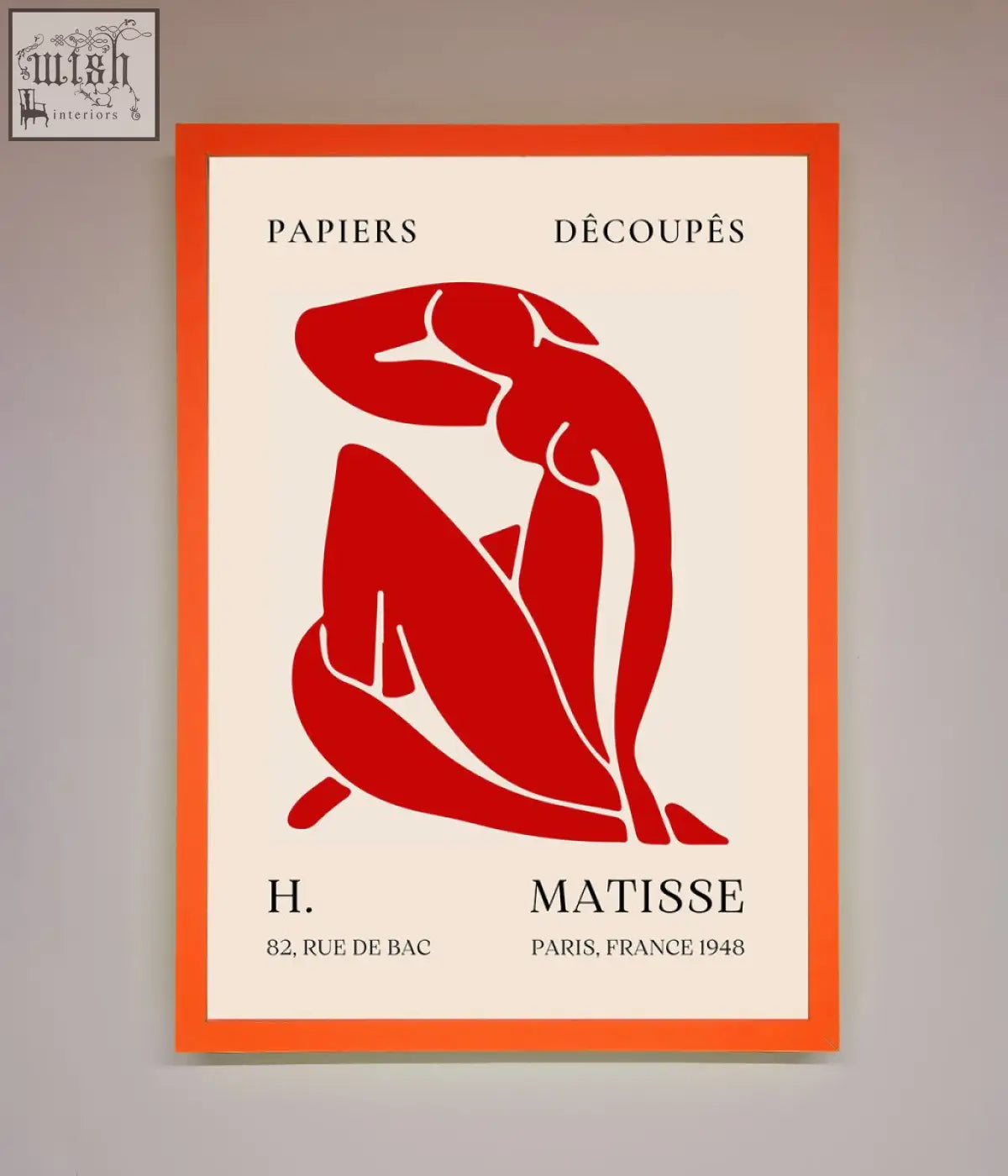 A framed print of a bold red matisse man silhouette with papiers découpés text on an off-white background