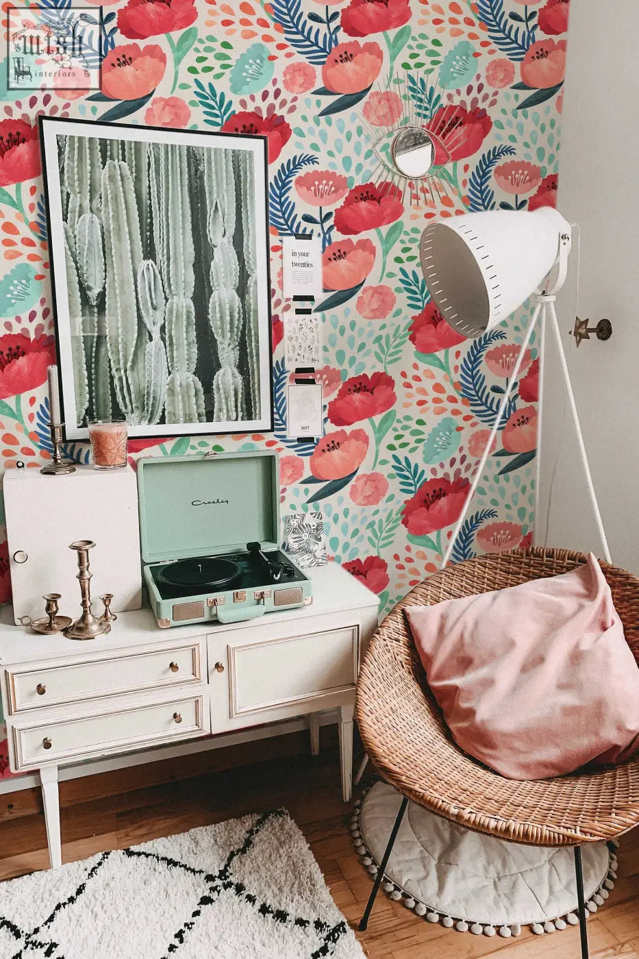 Mint green vintage record player with black turntable and silver accents beside red poppy flowers peel and stick wallpaper
