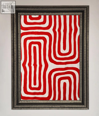 A framed poster of red waves abstract art with bold white looping patterns on textured fabric surface