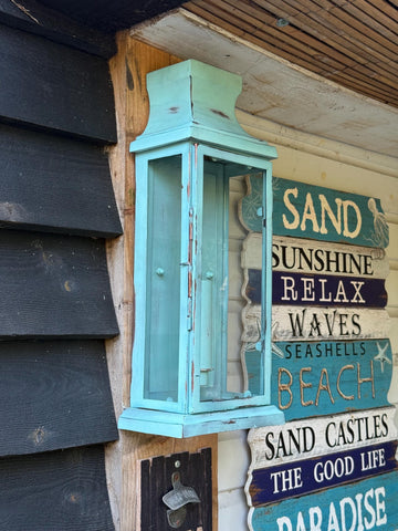 Distressed turquoise verdigris wall lantern sconce light with glass panels mounted on wood perfect flush mount wall light