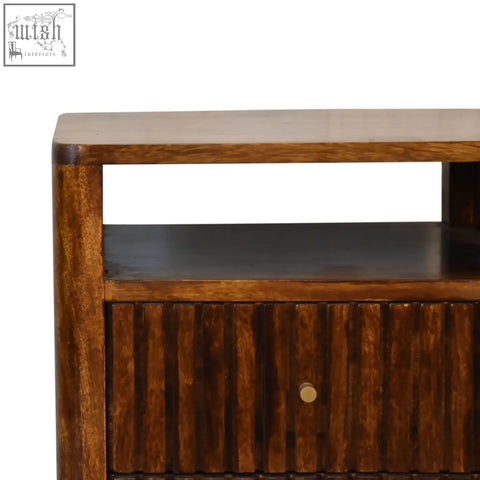 Dark brown reeve bedside table with ridged drawer fronts made of solid mango wood and a small round brass knob