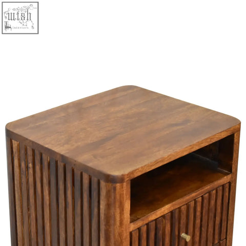 Dark brown reeve bedside table made of solid mango wood with vertical slat detailing and ridged drawer fronts