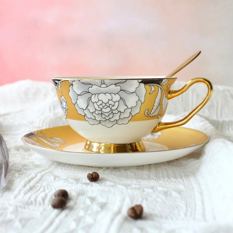 Elegant regal bloom bone china teacup and saucer with gold trim and white floral design perfect for tea time
