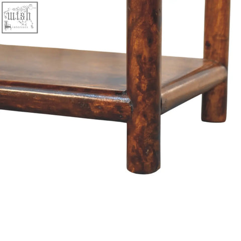 Dark brown solid mango wood console table with rustic hand finished surface and visible grain patterns regency bench chestnut linen