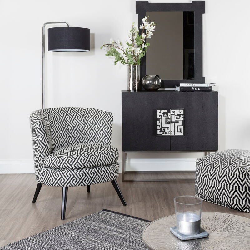 Black and white regent park greek key design round accent chair with geometric pattern and sleek tapered legs