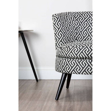 Regent park greek key design round accent chair with black and white geometric fabric and tapered wooden legs