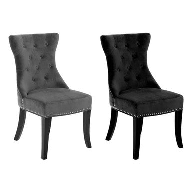 Pair of elegant black cotton velvet tufted dining chairs with nailhead trim perfect for stylish dining rooms