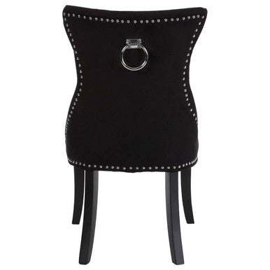 Regents park black cotton velvet dining chair with silver nailhead trim and central ring handle on the back