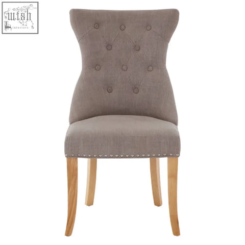 Beige tufted regents park mink linen dining chair with nailhead trim and light wooden legs