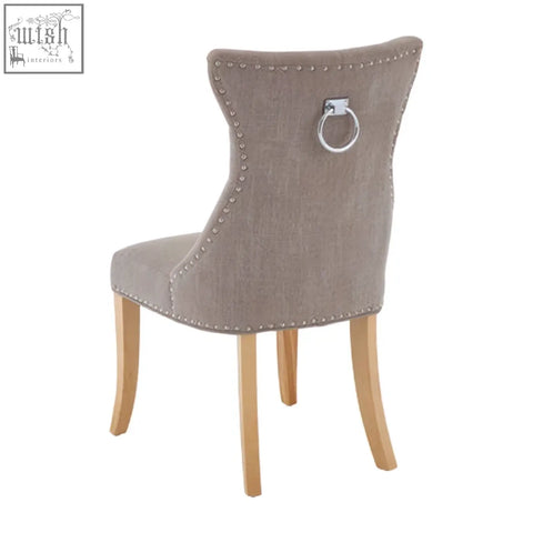 Beige regents park mink linen dining chair with silver nailhead trim and light wooden legs