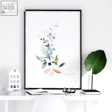 Minimalist botanical bedroom wall art set of 3 framed prints with soft green and peach hues in sleek black frames