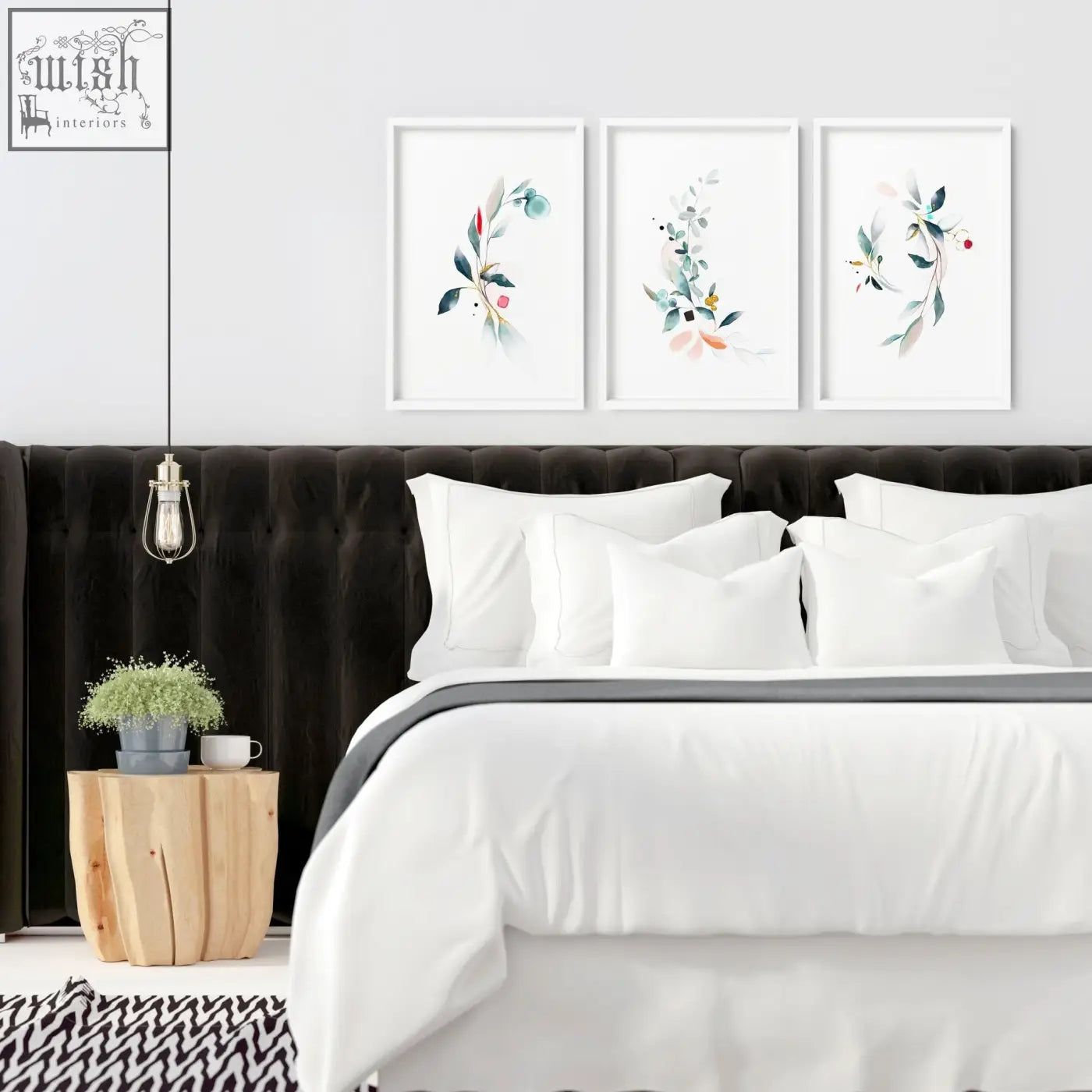 Three framed botanical bedroom wall art prints with soft green pink and blue watercolor florals above black headboard