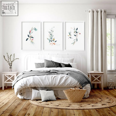 White framed botanical wall art with watercolor leaves and berries in soft greens pinks and golds for bedroom wall decor