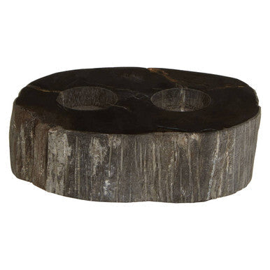 Dark rustic relic petrified wood tealight holder with two circular cutouts and natural textured surface