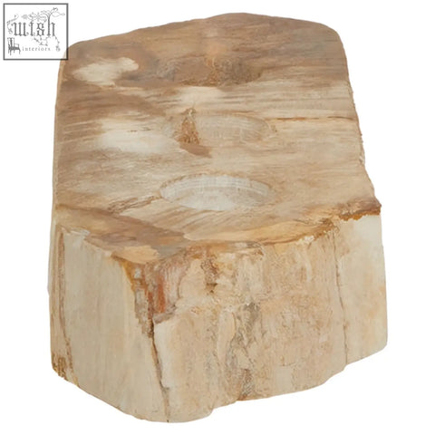 A rustic light brown relic petrified wood tealight holder with natural textured surface and visible concentric rings