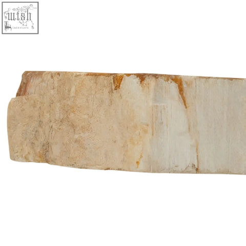 A beige and cream relic petrified wood tealight holder with natural rough textured edges for tabletop decor