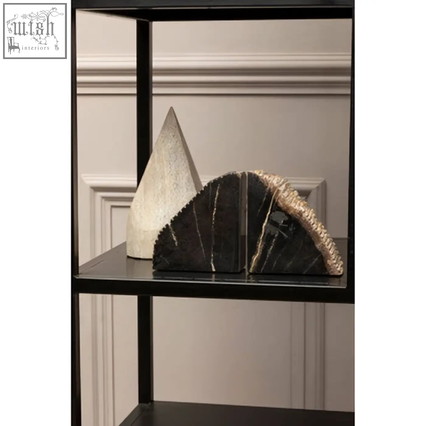 Black marble bookends with textured golden brown edges showcasing a sleek wood pyramid sculpture design