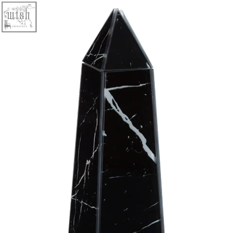 Renata large black marble design obelisk sculpture with striking white veining on a polished black marble surface