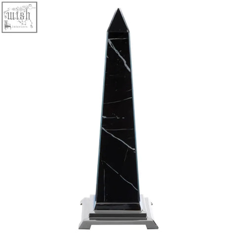 Renata large black marble design obelisk sculpture with white veining on a silver-toned metal base
