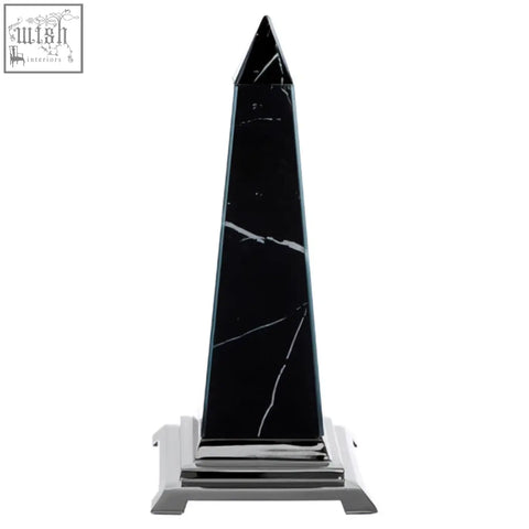 Renata small black marble design obelisk sculpture with white veining on a polished chrome base