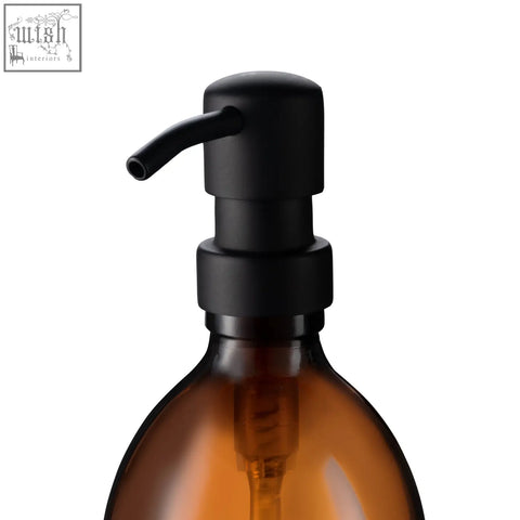 Black matte replacement pump dispenser made of 304-grade stainless steel atop an amber glass bottle