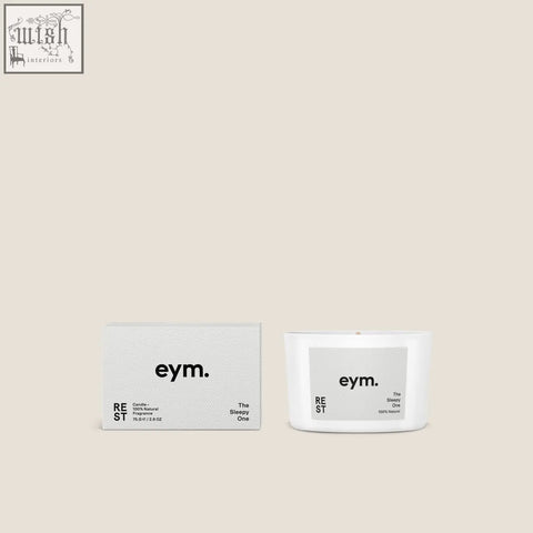 White ceramic mini candle with minimalist gray label and eym branding scented the sleepy one in a sleek design