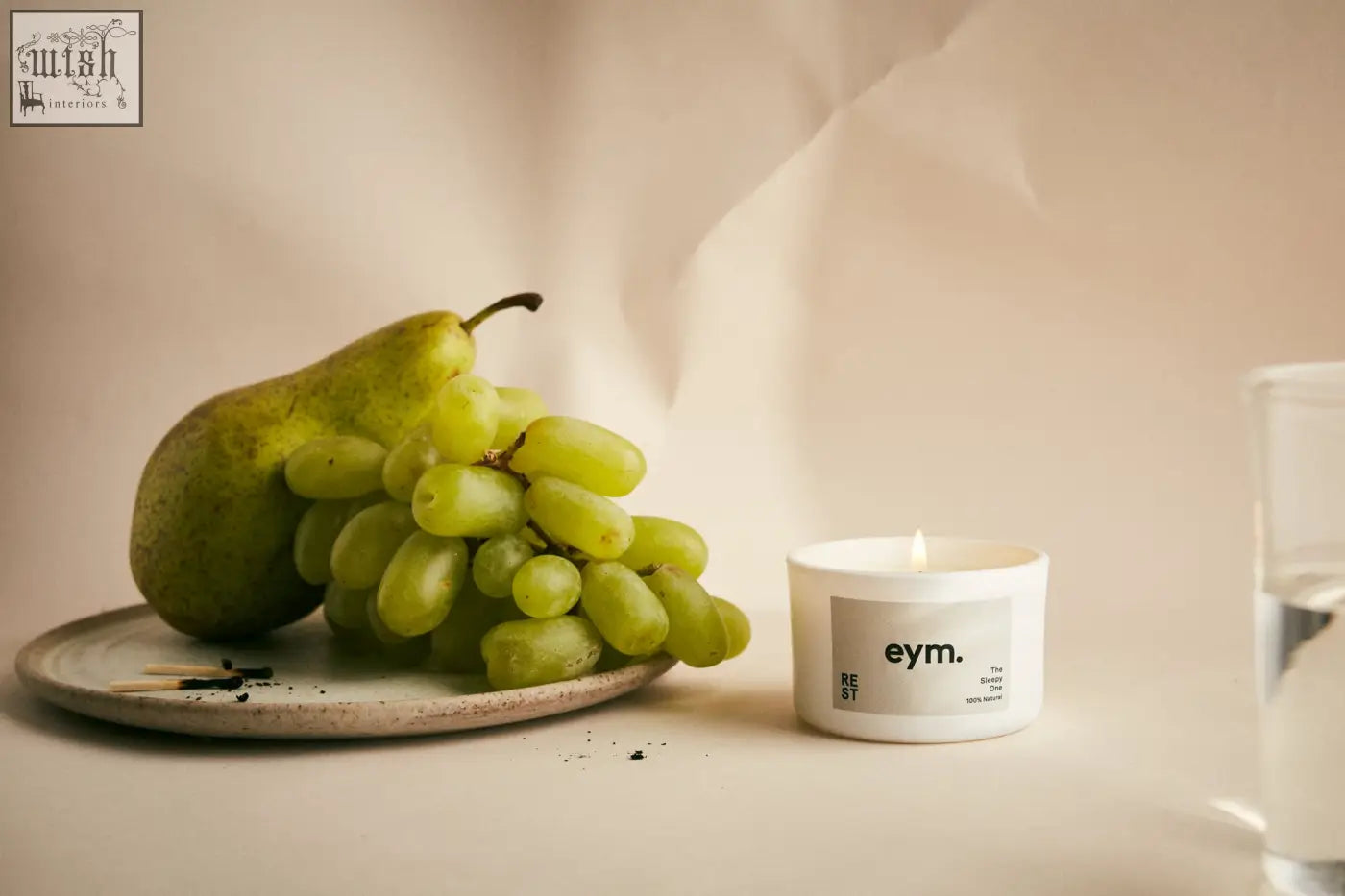 White cylindrical mini candle with minimalist eym label called the peace candle perfect for relaxation and rest