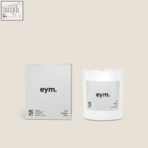 White glass standard candle with minimalist eym label designed for rest and relaxation