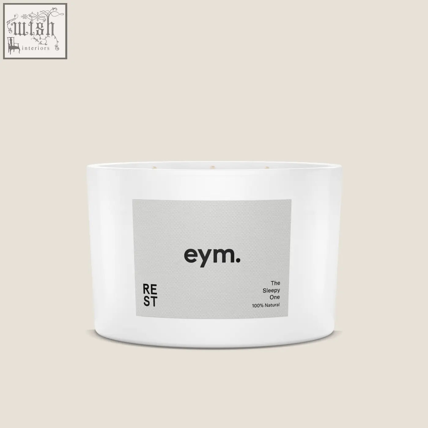 White cylindrical three wick candle in minimalist container with gray eym label the sleepy one natural scent rest
