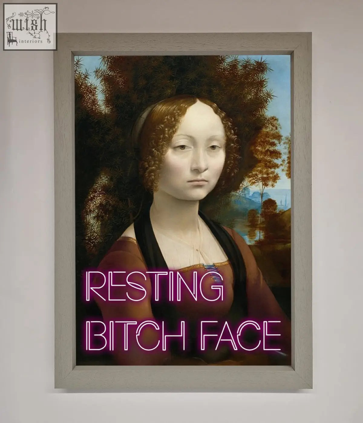 A framed print of a woman with brown hair and glowing pink neon resting bitch face text on her chest bitch face renaissance