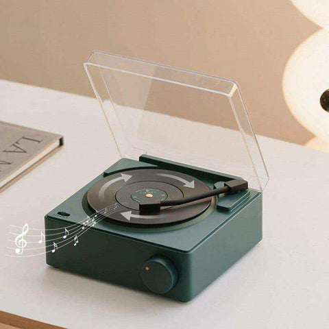 Dark green retro vinyl wireless bluetooth speaker with transparent lid and black vinyl disc for wireless bluetooth audio