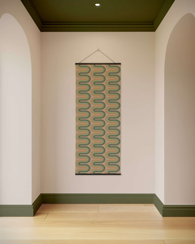 A retro wiggle stripe tapestry with a muted green and beige wavy pattern framed by dark olive green borders