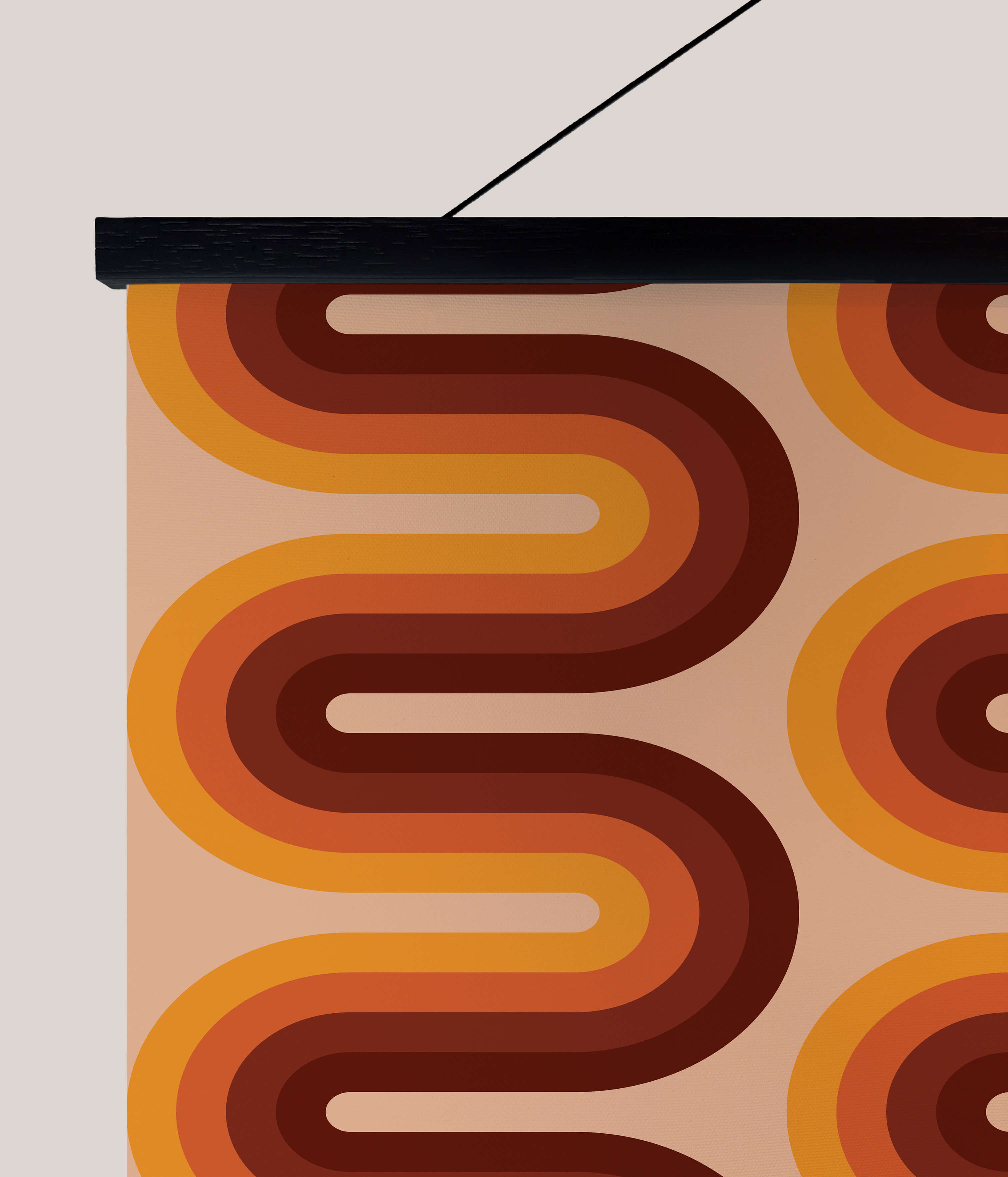 A retro wiggle stripe tapestry with bold orange and brown swirling patterns on a beige fabric wall hanging