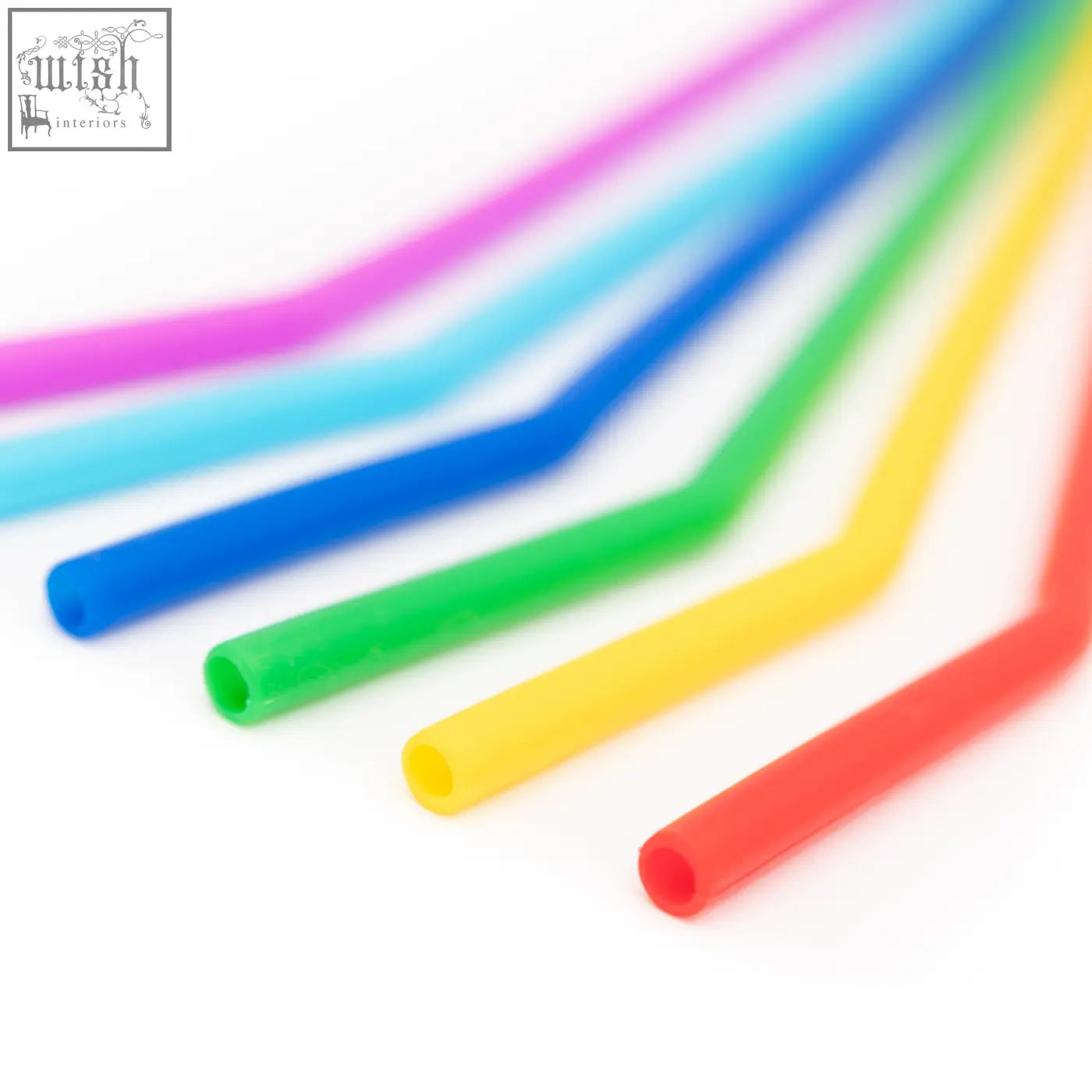 A set of colorful bendable silicone drinking straws arranged in a rainbow gradient from pink to red reusable pack